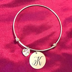 Gold K bangle bracelet